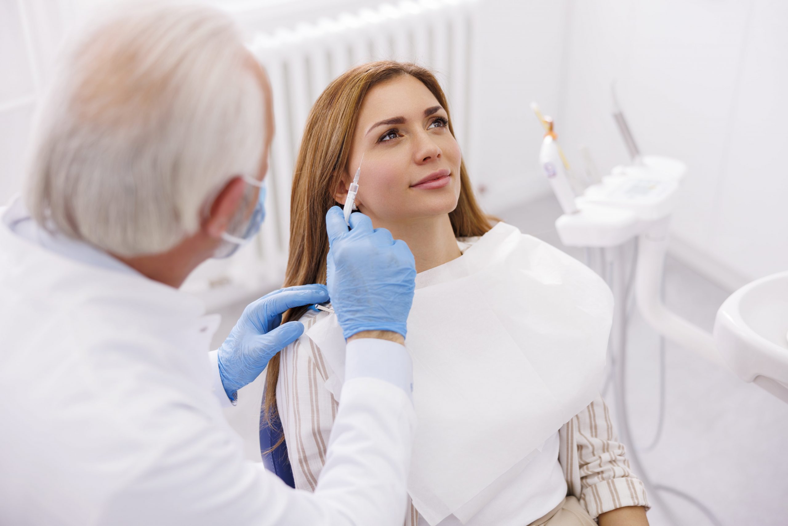 Patient getting injected with dermal fillers.