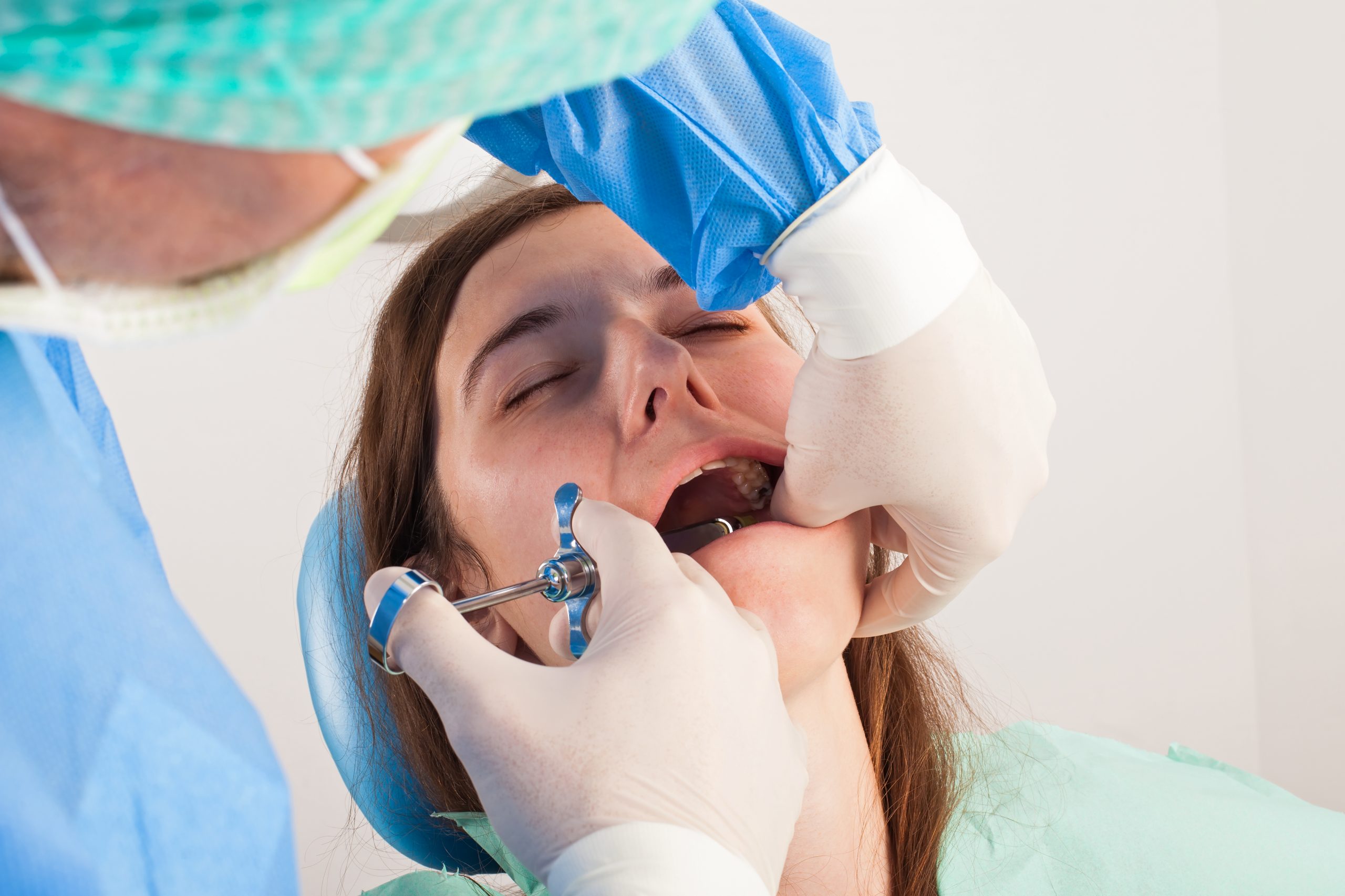 Woman receiving dental procedure.