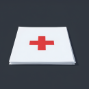 Stack of white papers featuring a red medical cross centered on the top page, set against a dark background.